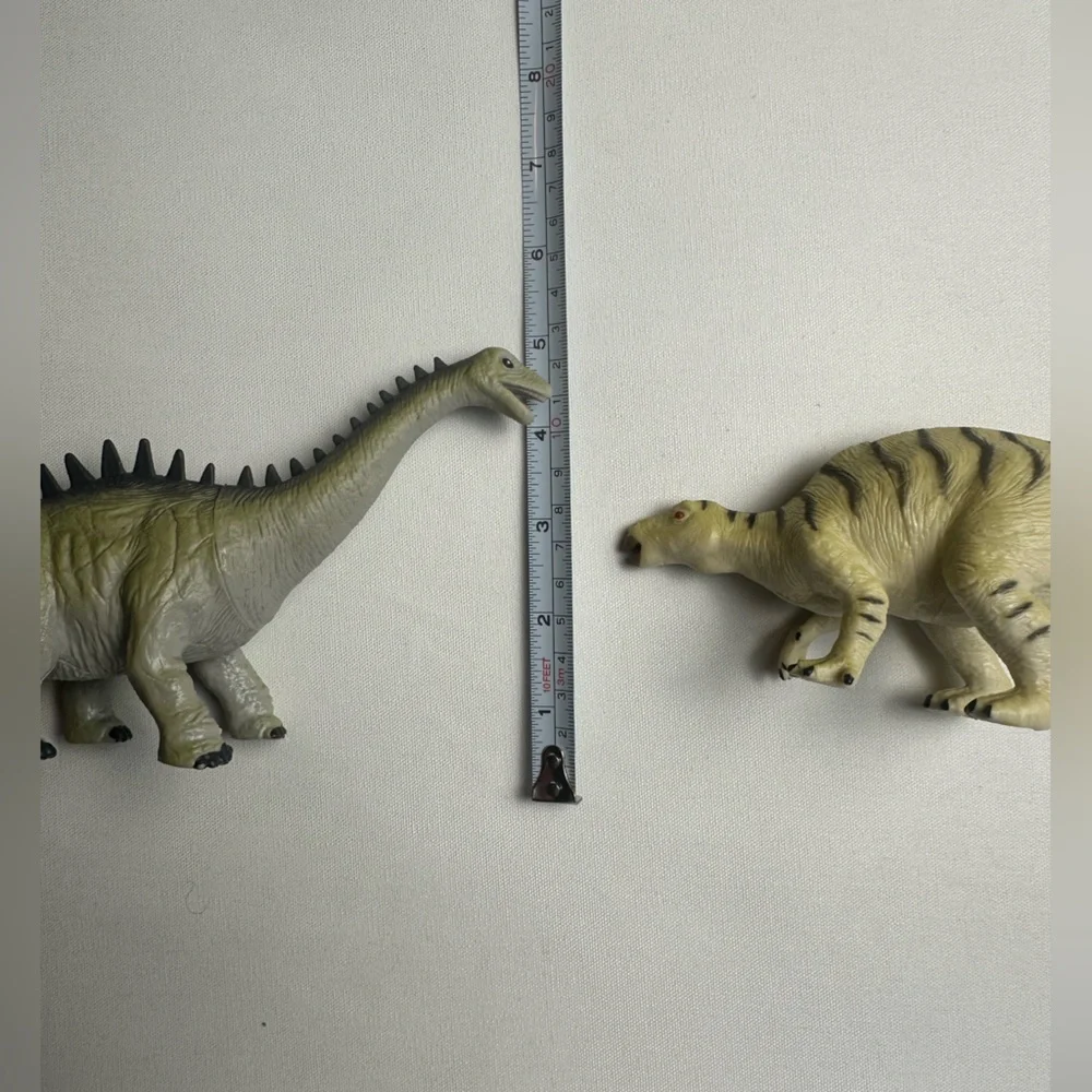 Bundle of multiple sized dinosaurs. 5 are wind up cars. See video.